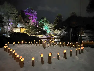 柔らかな光が城下町を包む 会津絵ろうそくまつりで鶴ケ城に地上絵 御薬園ではライトアップと共演