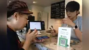 デジタル地域通貨、消費拡大で街活性化も維持コストが壁に